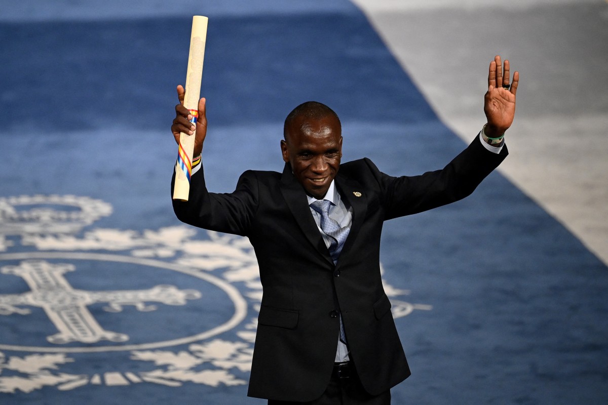 Understanding Eliud Kipchoge’s role at the next Olympic games - Kenyan marathon world record holder Eliud Kipchoge gestures after receiving the 2023 Princess of Asturias Award for Sports on 20 October 20 2023. (Photo by MIGUEL RIOPA / AFP)