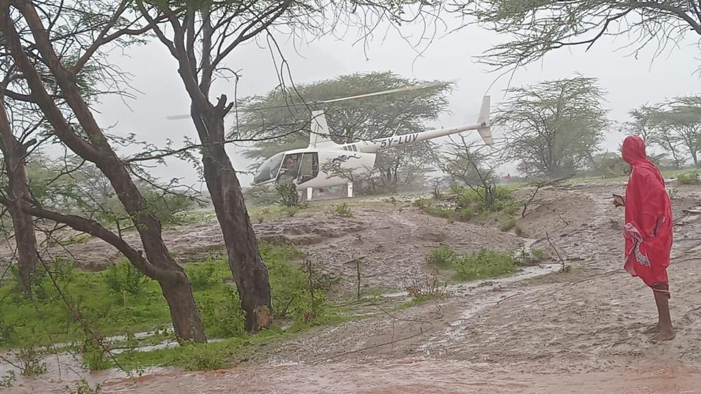 Helicopter saves eight people marooned by floods