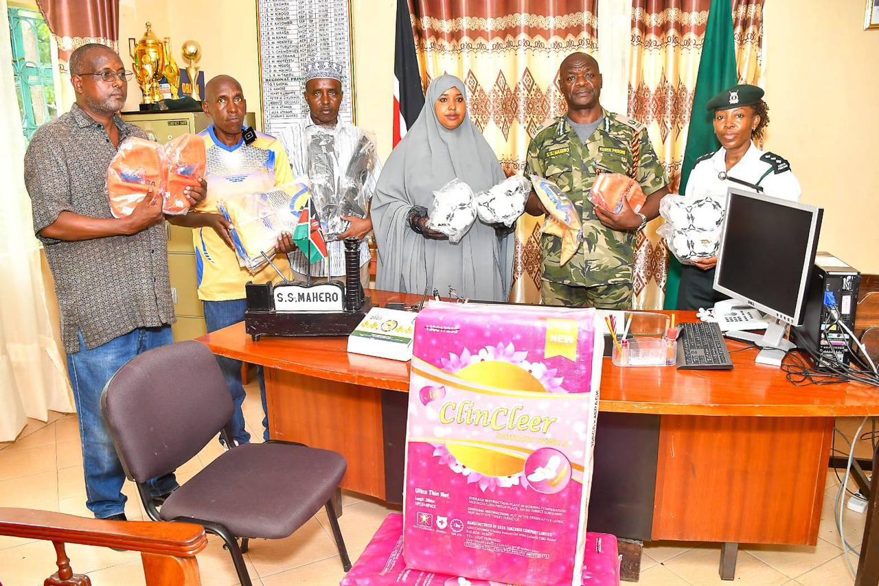 Garissa County scores on rehab goals with sports donation to main prison camp - Garissa County Executive Committee on Sports members led by Hawa Abdi Sahal and Prisons North Eastern commander Shaban Mahero.