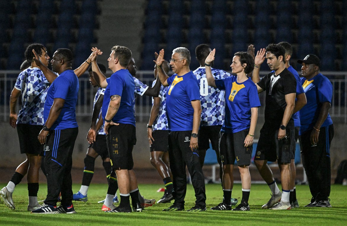 AFCON 2023: Tanzania takes on Morocco as Congo and Zambia battle in Wednesday's action - Tanzania's coach Adel Amrouche (C), team players and staff attend a training session at the Auguste Denise stadium, on January 16, 2024. (Photo by Sia Kambou/ AFP)