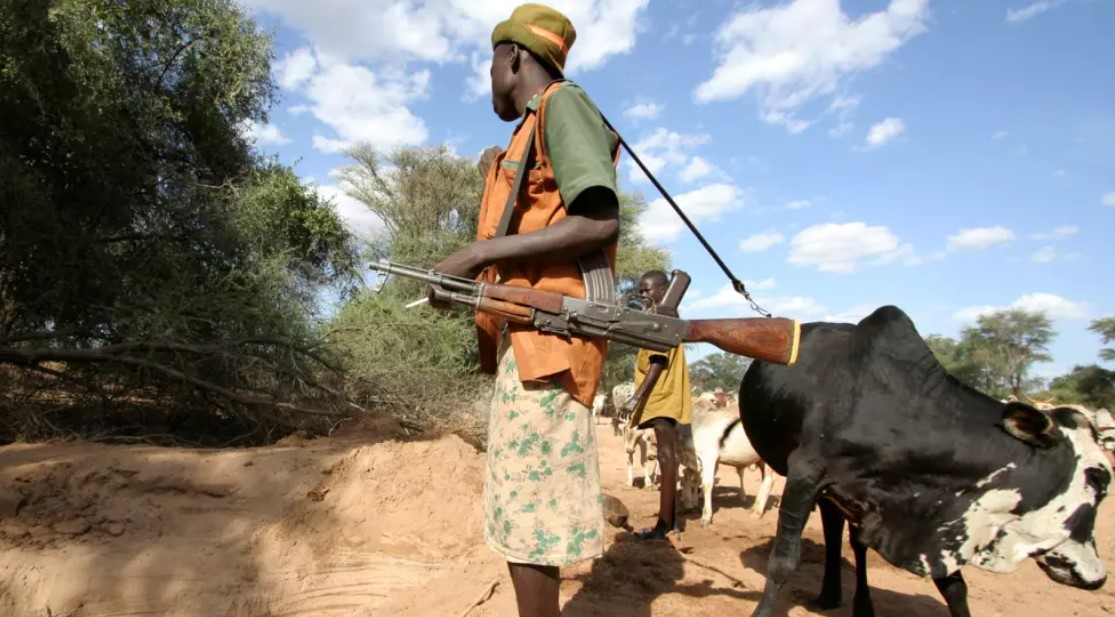A pastoralist with his livestorck at a water point in Isiolo. (Photo: Siegfried Modola/IRIN/TNH) 