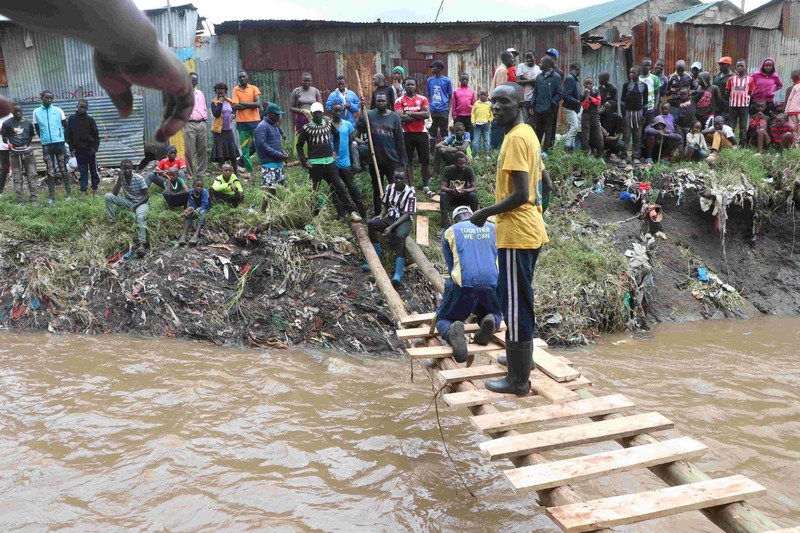 Kiambiu youth erect makeshift bridge as floods leave trail of destruction