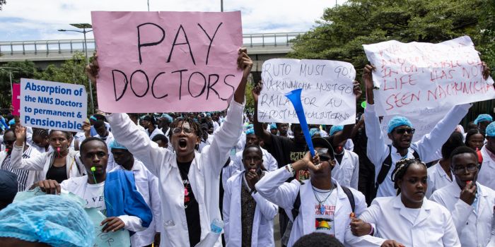 High Court bars police from interfering with ongoing doctors' strike - Kenyan doctors chant as they march towards the health ministry headquarters protesting with placards to demand better pay and working conditions in the capital, Nairobi on April 9, 2024. (Photo: Simon Maina/ AFP)