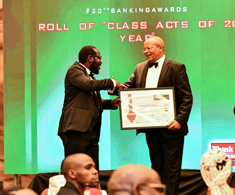 Equity Bank Kenya Managing Director, Gerald Warui (Right), receive a certificate of recognition in Class Acts of 20 years from the CEO Think Business, Ochieng’ Oloo (Left), during the 2024 Think Business Awards.