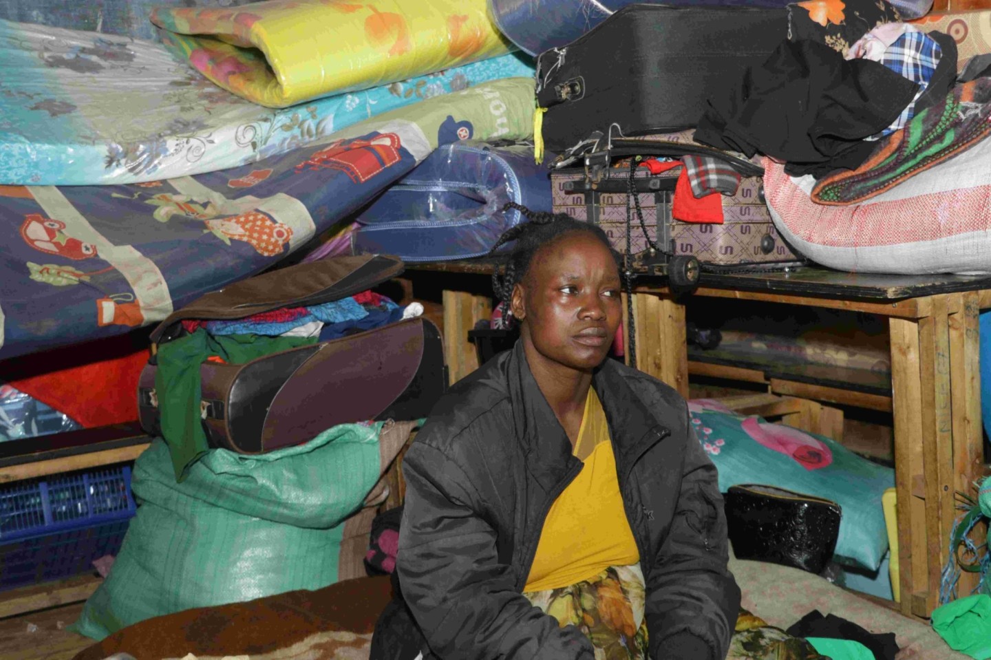 Phyllis Awinja one of the flood-affected victim, sitting on a mattress at Why Not Camp in Mathare Mashimoni Mabatini ward on May 8. Photo by Justine Ondieki. 