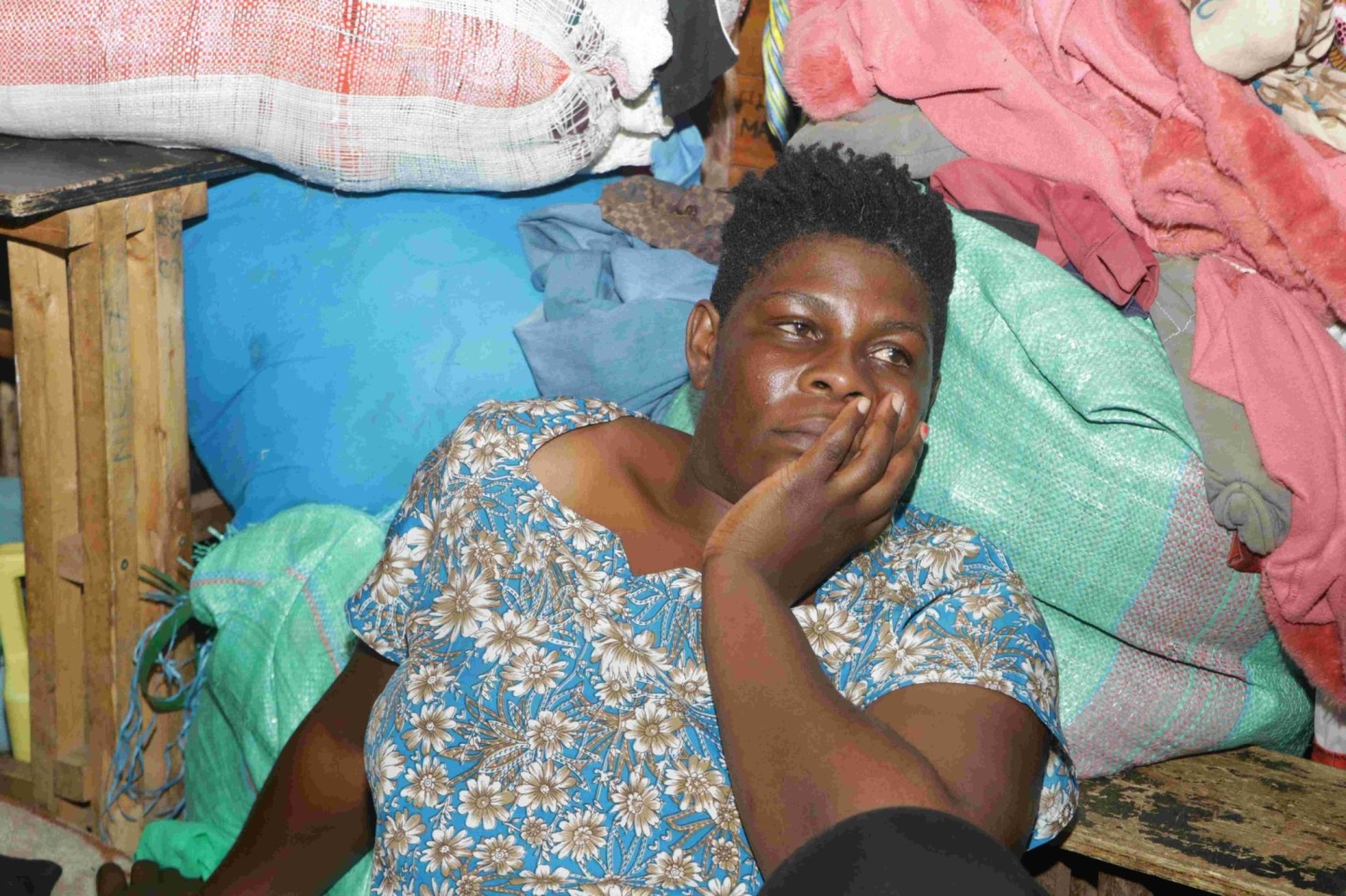 Risper Litanga, one of the people evicted from Mathare Mashimoni riparian land and who has been camping at Why Not Primary School ponders her next move as schools are set to reopen on May 13, 2024. photo by Justine Ondieki.