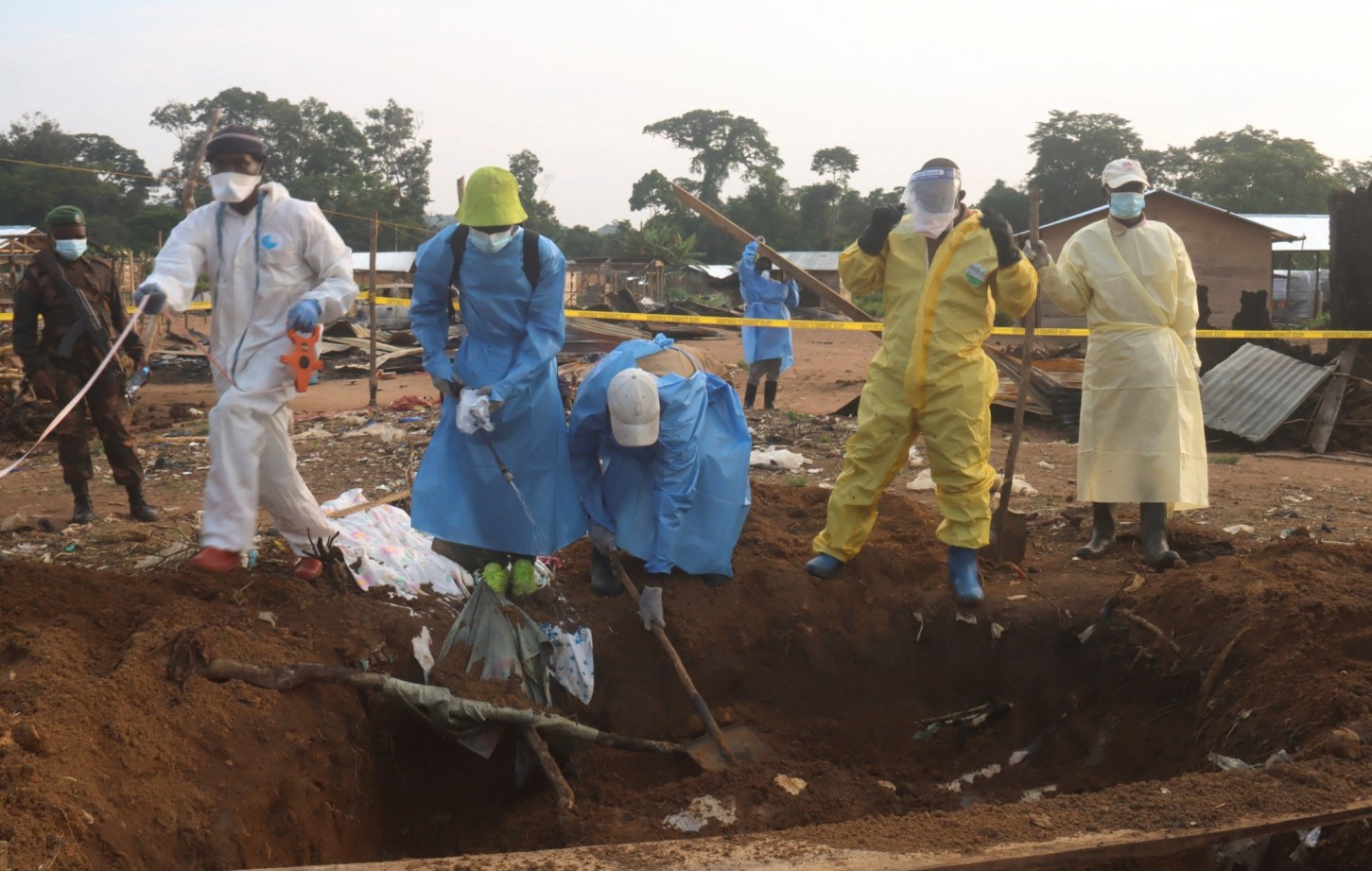 Volunteers and Congolese security officers dig a shallow grave in search for the bodies of residents killed following an attack by suspected Islamist rebels from the Allied Democratic Forces (ADF), within Masala village in Beni territory of eastern Democratic Republic of Congo June 9, 2024. REUTERSGradel Muyisa Mumbere