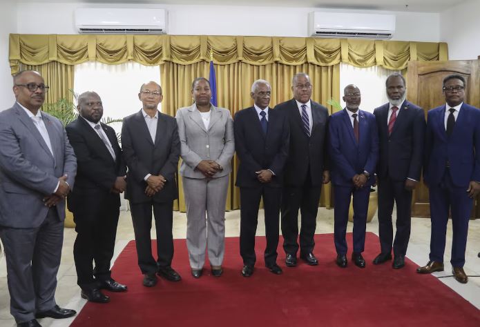 Haiti names new cabinet, in strong shift from previous government - Garry Conille, fourth from right, poses for photos with members of the transitional council after his swearing-in ceremony as prime minister in Port-au-Prince, Haiti, on June 3, 2024. (Photo: ODELYN JOSEPH/AP)