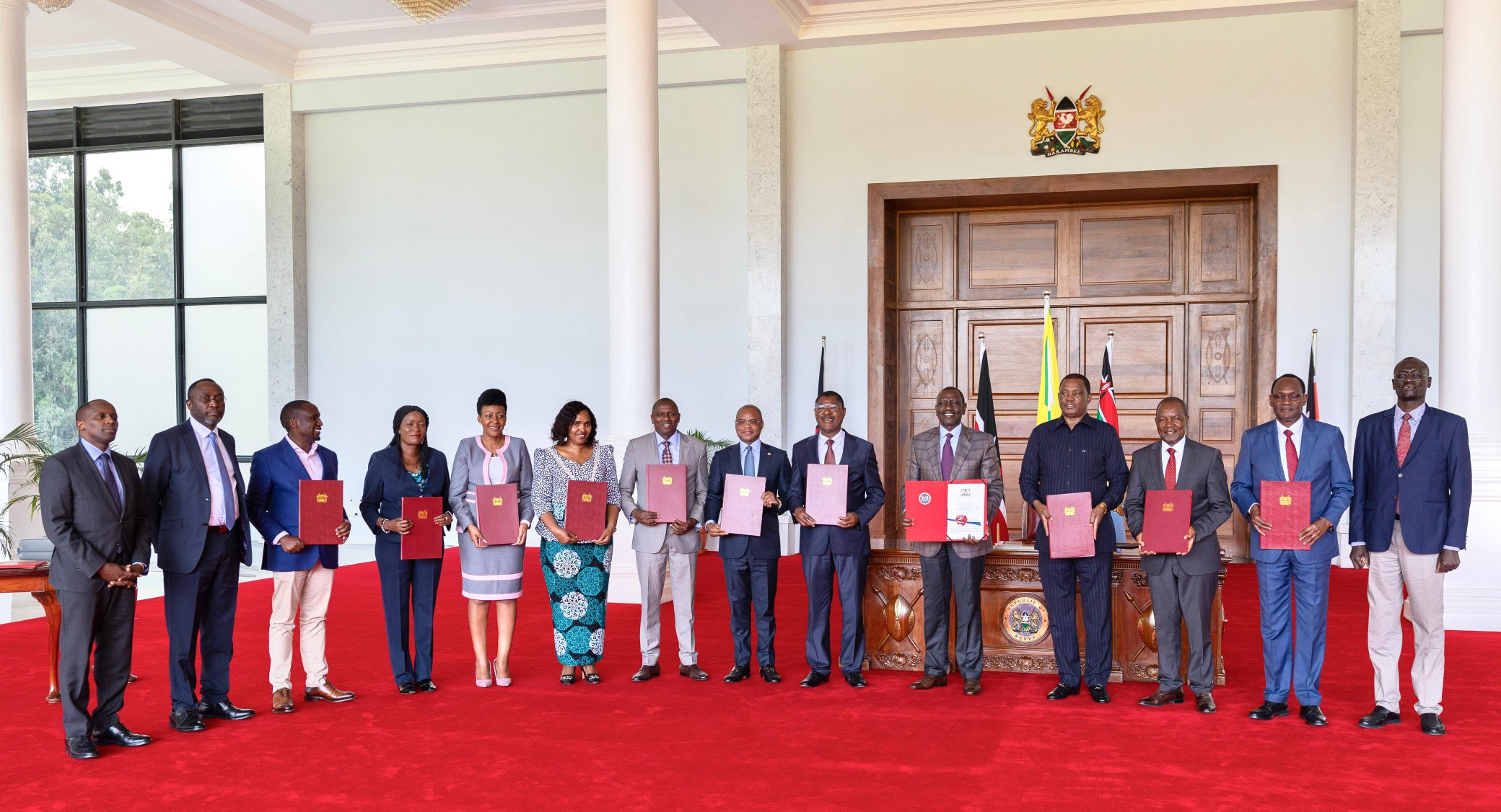 President William Ruto (5th right) poses for a photo with Treasury CS Njuguna Ndung'u (3rd right), Attorney General Justin Muturi (4th right), Speakers Moses Wetangula (6th right) and Amason Kingi (centre), and Majority leaders in the National Assembly and Senate, Kimani Ichung'wah (centre) and Aaaron Cheruiyot (4th left) respectively among other leaders a State House, Nairobi after sigining the Appropriations Bill, 2024, on Friday, June 28, 2024. 