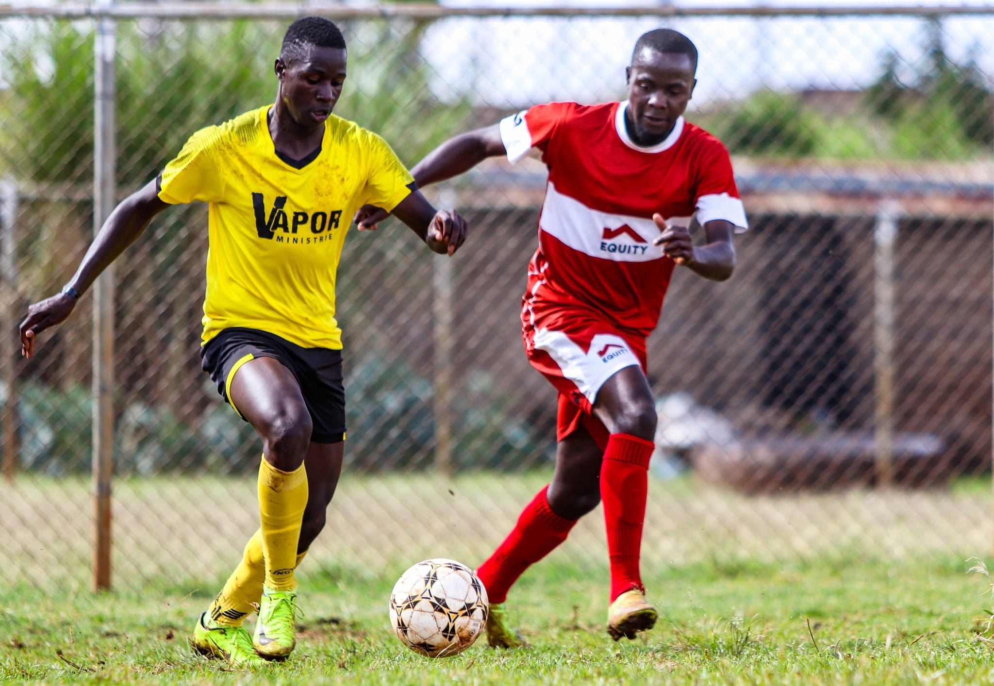 Tyrone Owino's successful transition from footballer to entrepreneur - Tyrone Owino, right, in a past Equity FC match. Photo courtesy of Equity FC