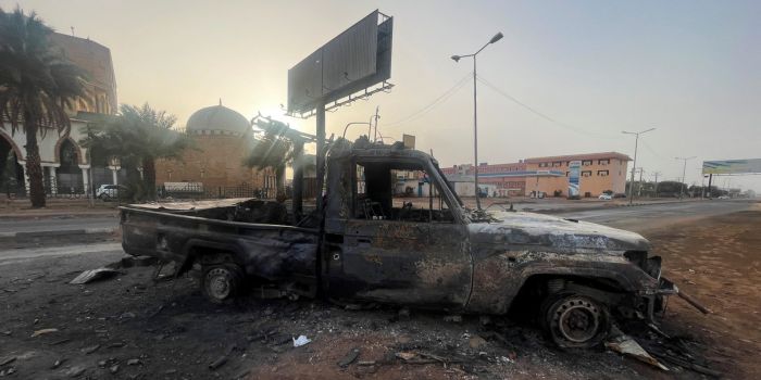 Refugees in Sudan in danger as war approaches their camps - A burned vehicle is seen in Khartoum, Sudan April 26, 2023. (Photo: El-Tayeb Siddig/Reuters)