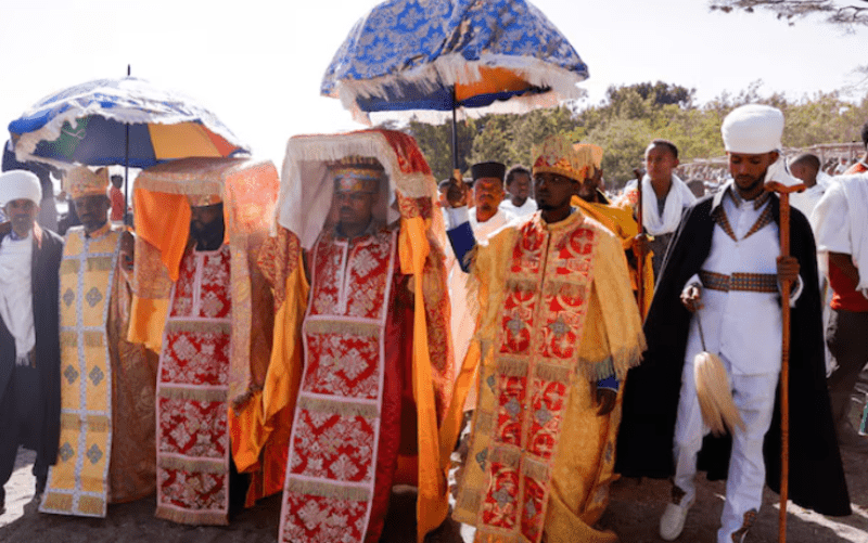 Ethiopian Orthodox Church dismayed by exclusion from national dialogue conference - Ethiopian Orthodox priests carry ‘Tabot’ the replica of the Ark of the Covenant during Epiphany celebration to commemorate the baptism of Jesus Christ on Lake Dambal in Batu town of Oromia Region, Ethiopia on January 19, 2023. (Reuters)