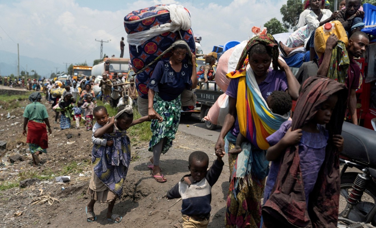 Congolese people carry their belongings as they flee from their villages around Sake, in Masisi territory, following clashes between M23 rebels and the Armed Forces of the Democratic Republic of Congo, toward Goma, North Kivu province, Democratic Republic of Congo, February 7, 2024. (Photo: REUTERS/Arlette BashiziFile Photo)