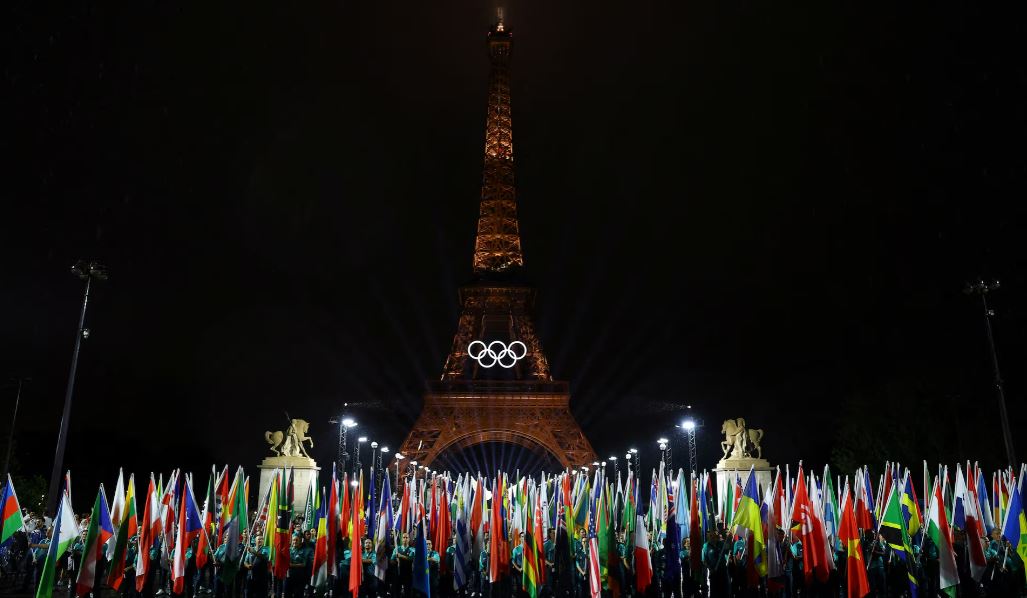 UN urges peace and respect for Olympic Truce during Paris Summer Games - Flags of participating countries are carried during the opening ceremony. (Photo: REUTERS/Stephanie Lecocq)