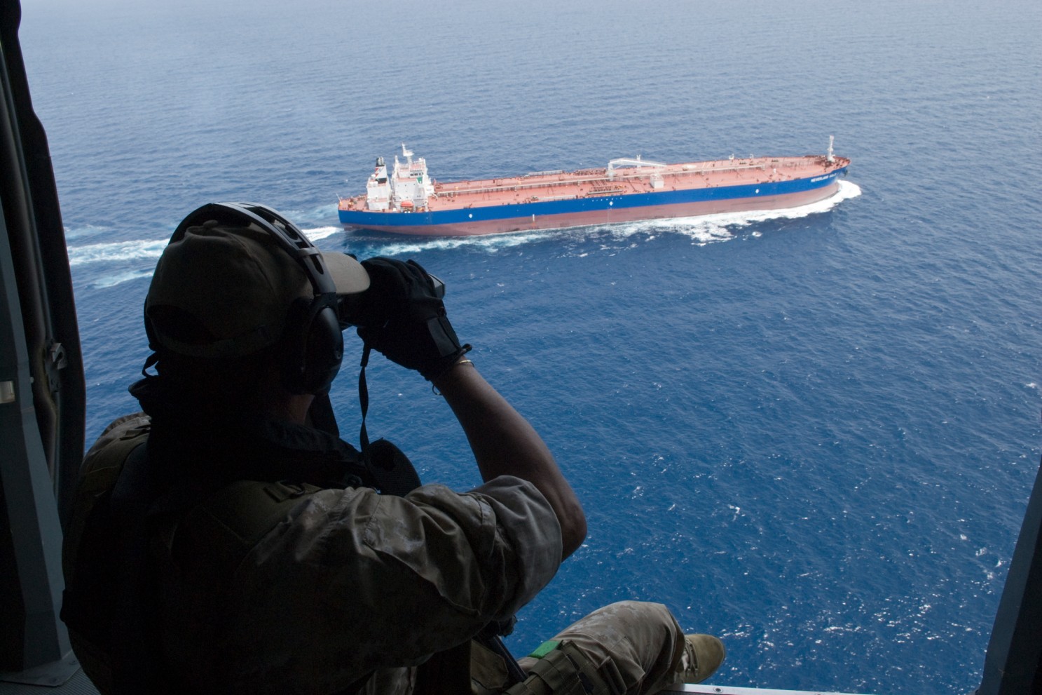 An EU Naval Force officers watches over a freighter on the Indian Ocean. (Photo: Handout)