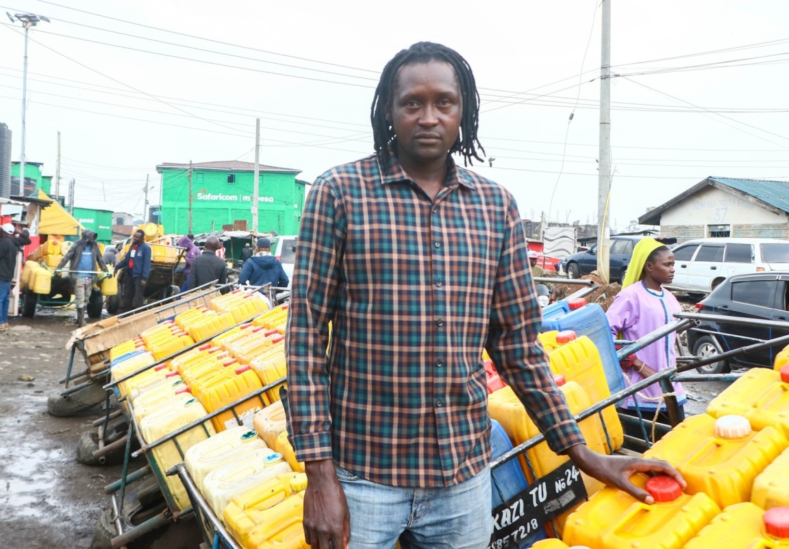 Christopher Muli poses for a picture in front of his mkokoteni at California ward in Kamukunji, Nairobi during a street interview with the Eastleigh on July 10, 2024. (Photo: Justine Ondieki) 