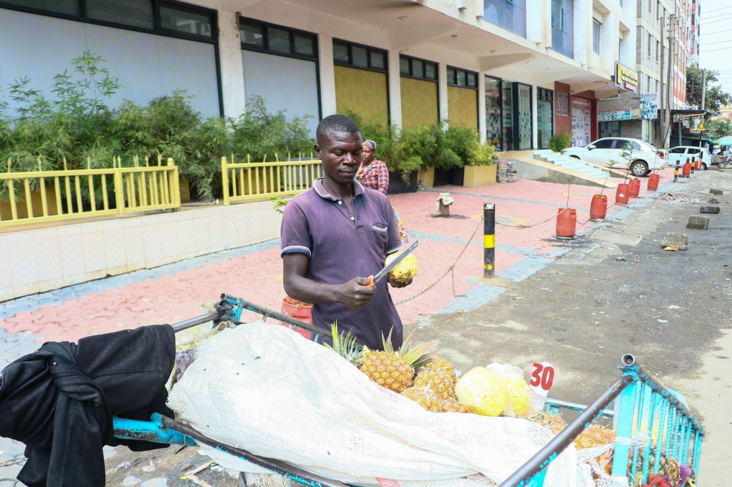 Rodgers Munyoki poses for a picture in front of his mkokoteni at California ward in Kamukunji, Nairobi on July 10, 2024. (Photo: Justine Ondieki) 