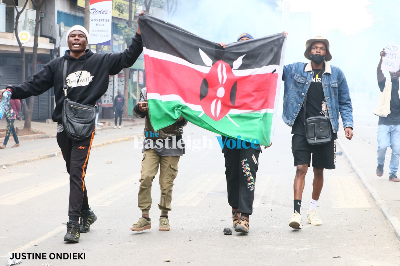 Protesters march with a Kenyan flag along Moi Avenue, Nairobi, during the anti-government demos on Tuesday, July 16, 2024. (Photo: Justine Ondieki/EV)