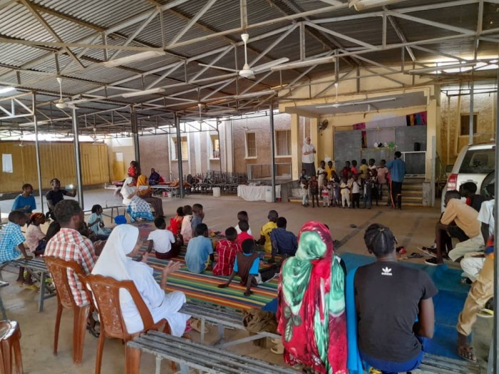 Refugees attend an event at "Dar Mariam" a Catholic church and school compound in al-Shajara district, where they took shelter, in Khartoum, Sudan, in this undated handout picture. Father Jacob Thelekkadan/Handout via REUTERS.