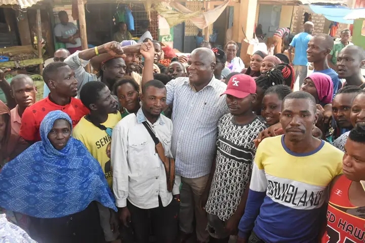 :Kwale deputy governor Chirema Kombo posing with the Ibiza traders for a photo