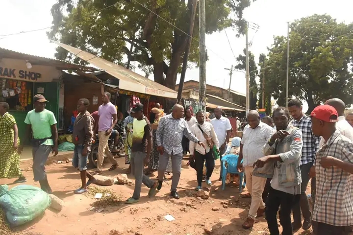 Kwale deputy governor Chirema Kombo in striped short sleeve shirt accessing the damage caused by the inspectorate.