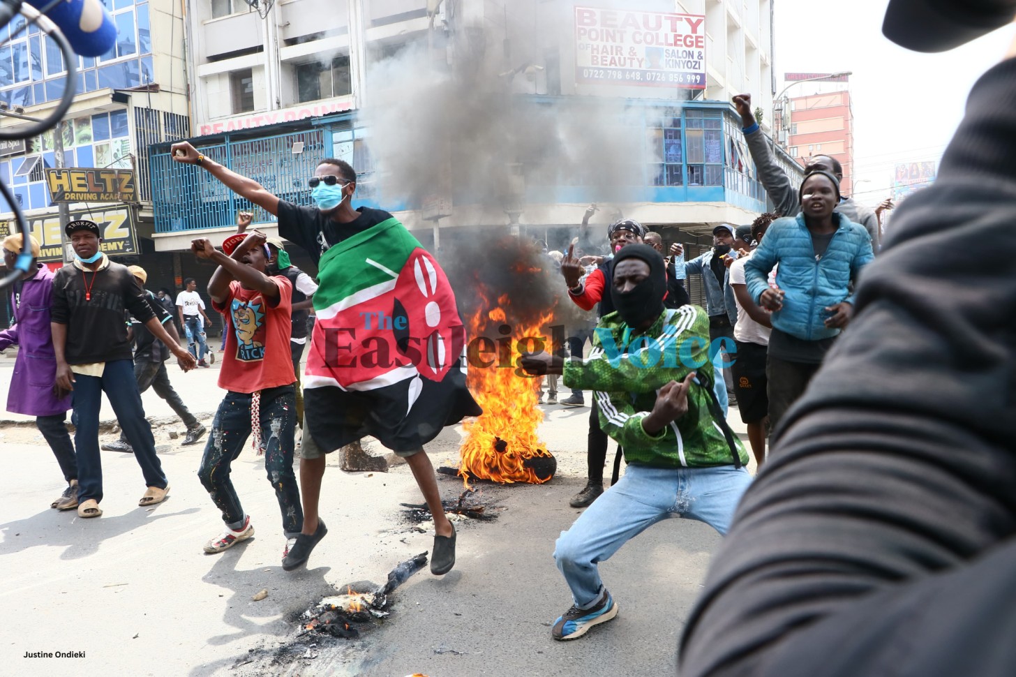 Protesters carry a Kenyan flag after lighting a fire along Tom Mboya Street on Tuesday, July 2, 2024, while demonstrating against the government. (Photo: Justine Ondieki/EV)