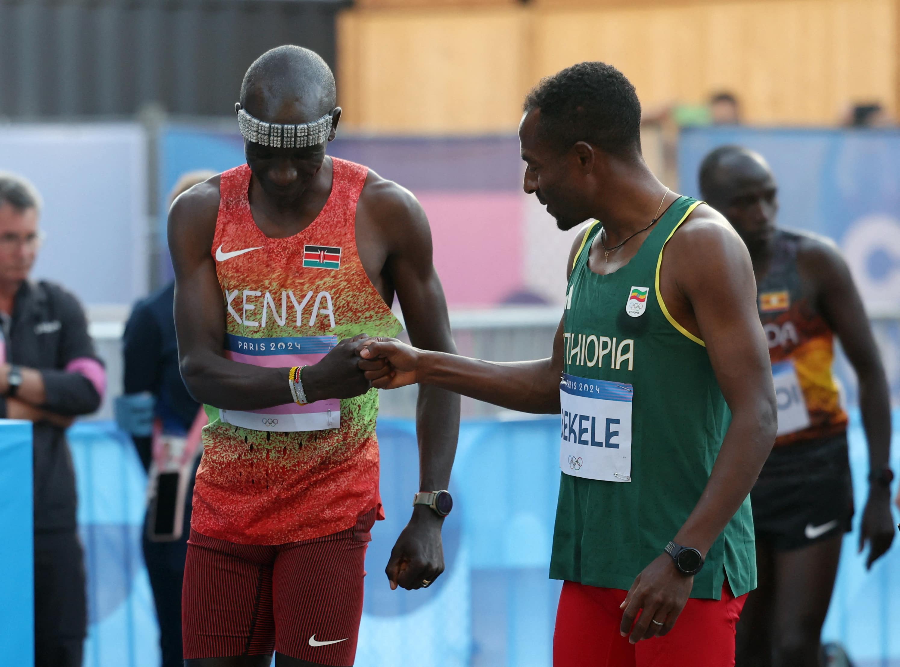 Kenenisa Bekele opens up about Paris Olympics struggles and future plans - Eliud Kipchoge of Kenya bumps fists with Kenenisa Bekele of Ethiopia before the Paris Olympics marathon. REUTERS/Isabel Infantes