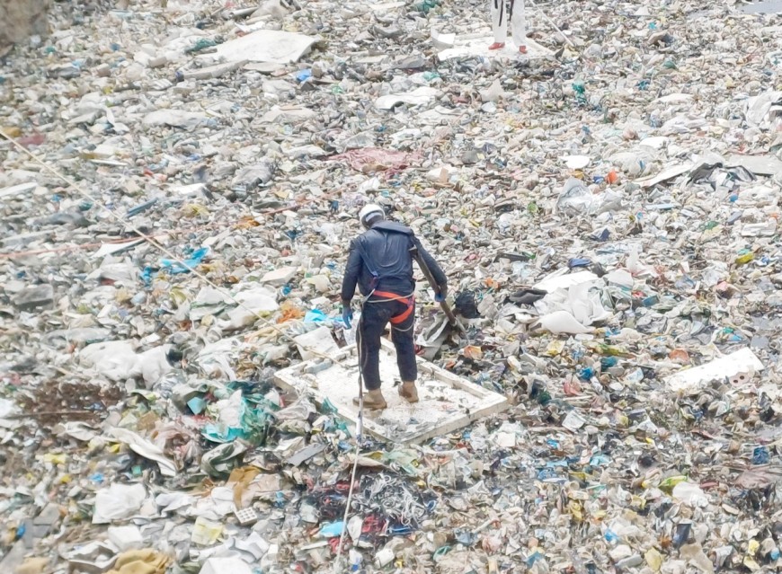 A volunteer searching for bodies at the Kware dumpsite on July 31, 2024. (Photo: Mary Wambui, EV)