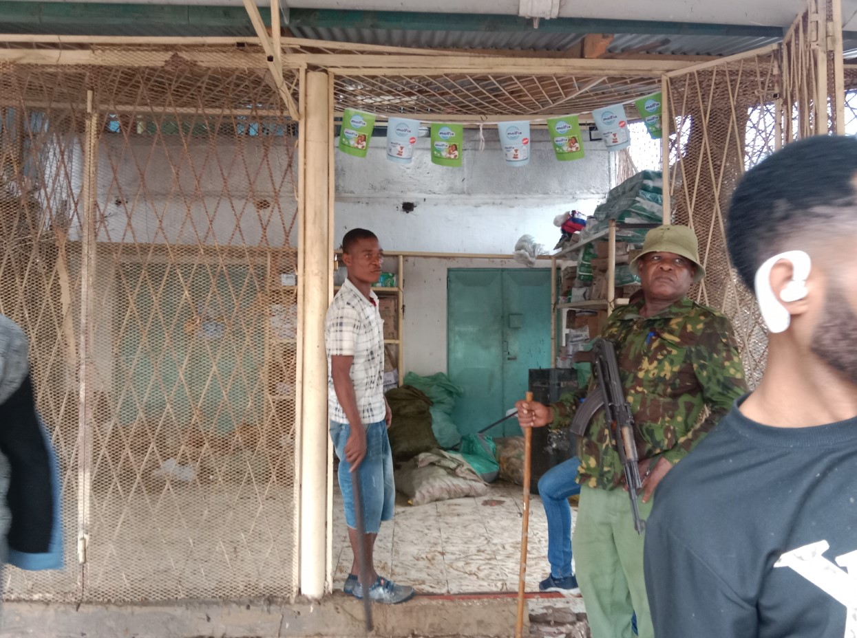 Police guard property at Ibiza Market, Kwale County, after a fire burned down a shop on Wednesday, August 7, 2024. (Photo: Mishi Gongo)