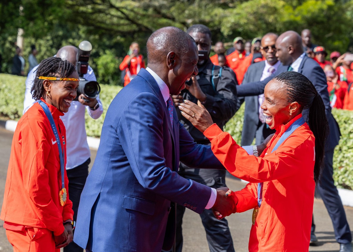 Ruto calls for continuous improvement to build on Kenya's Olympic success - President William Ruto shares a light moment with Olympic Champion Beatrice Chebet (right) as Olympic record holder Faith Kipyegon looks on at the Eldoret State Lodge on August 15, 2024. (Photo: PCS)