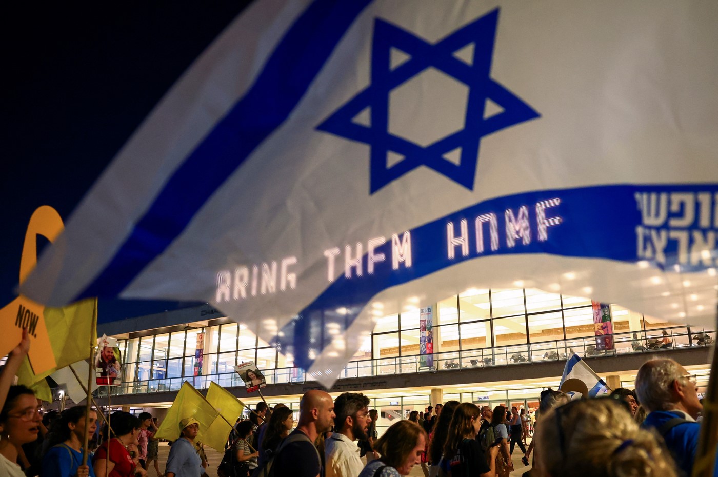 A "Bring them home" sign is displayed as families of Israeli hostages who are being held in Gaza since the deadly October 7 attack, march amid a new round of Israel-Gaza ceasefire talks, in Tel Aviv, Israel, August 15, 2024. (Photo: REUTERS/Florion Goga)