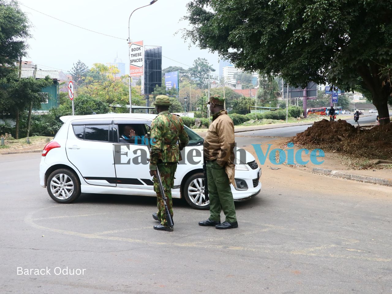 Police screen a vehicle at Processional Way, after erecting a barrier to prevent motorists from heading to State House on Thursday, August 8, 2024. (Photo: Barack Oduor)