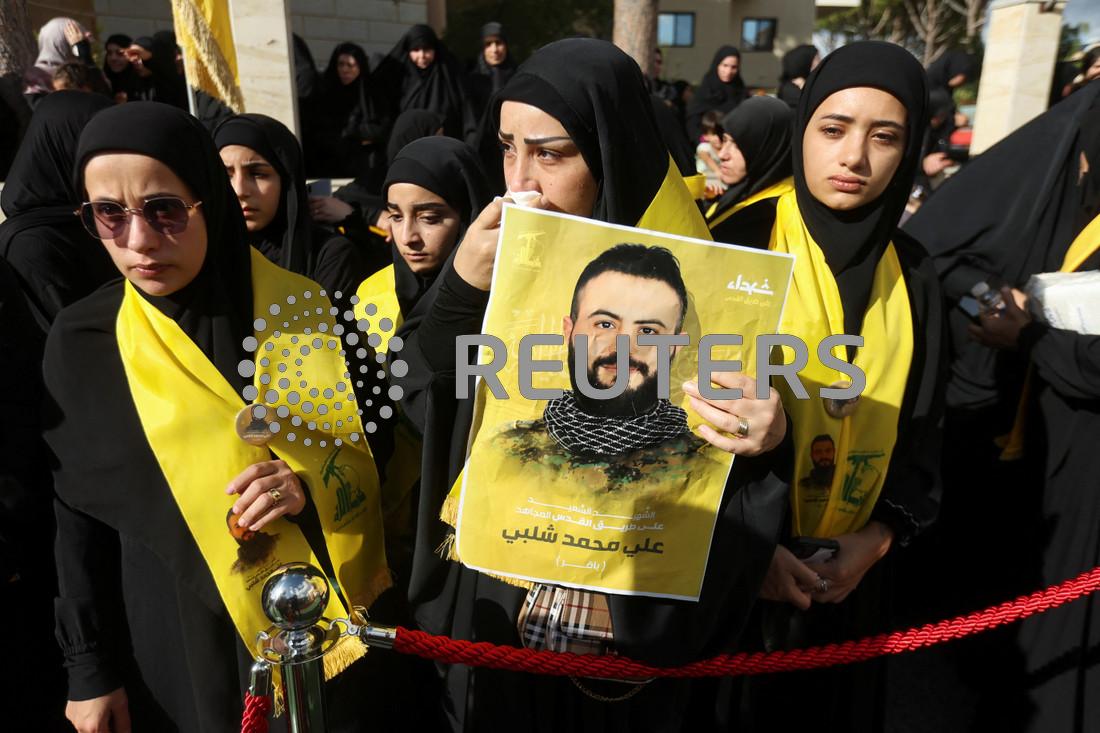 Israel planted explosives in Hezbollah's Taiwan-made pagers, say sources - Mourners attend the funeral of Hezbollah member Ali Mohamed Chalbi in Kfar Melki, Lebanon on September 19, 2024, after hand-held radios and pagers used by Hezbollah detonated across Lebanon. (Photo: REUTERS/Aziz Taher)