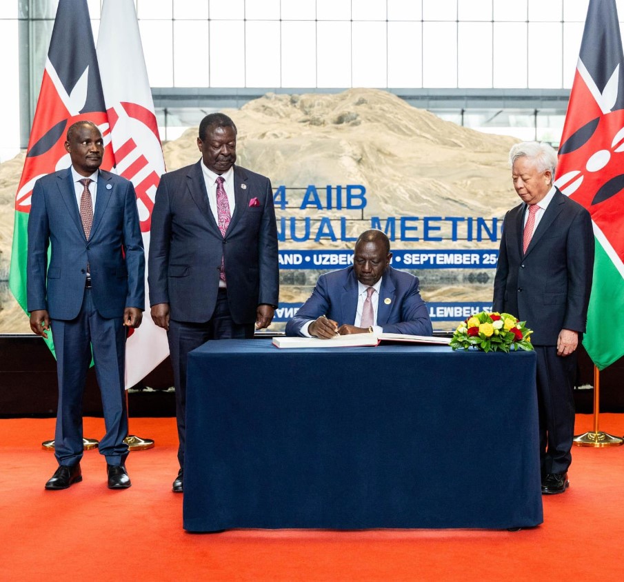 Treasury and Foreign Affairs CSs John Mbadi and Musalia Mudavadi witness President William Ruto ratify Kenya's agreement with AIIB to join the bank as a fully paid member on Tuesday, August 3, 2024. (Photo: PCS)