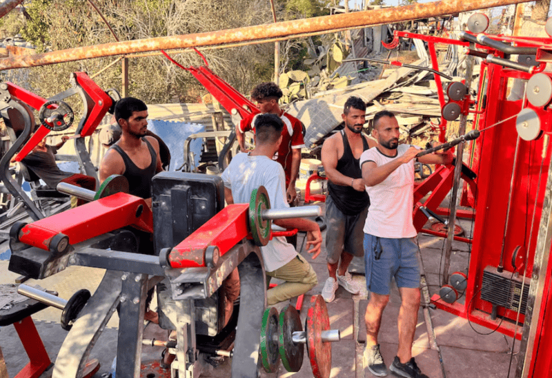 In gym salvaged from rubble, Gazans release anger on weight machines