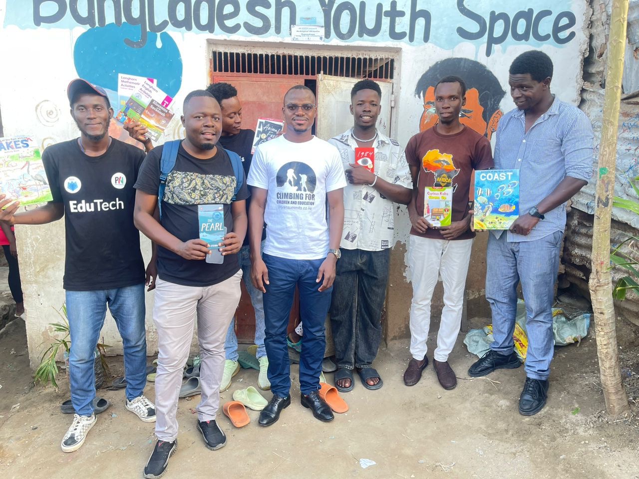 Pwani Youth Network led by their founder and CEO Alfred Sigo and the librarians at Bangladesh Community library