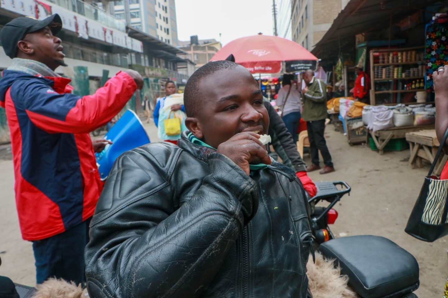 Kenedy Murangila, one the lover of raw cassava at his boda boda stage at Eleven Street in Eastleigh. (Photo: Justine Ondieki)