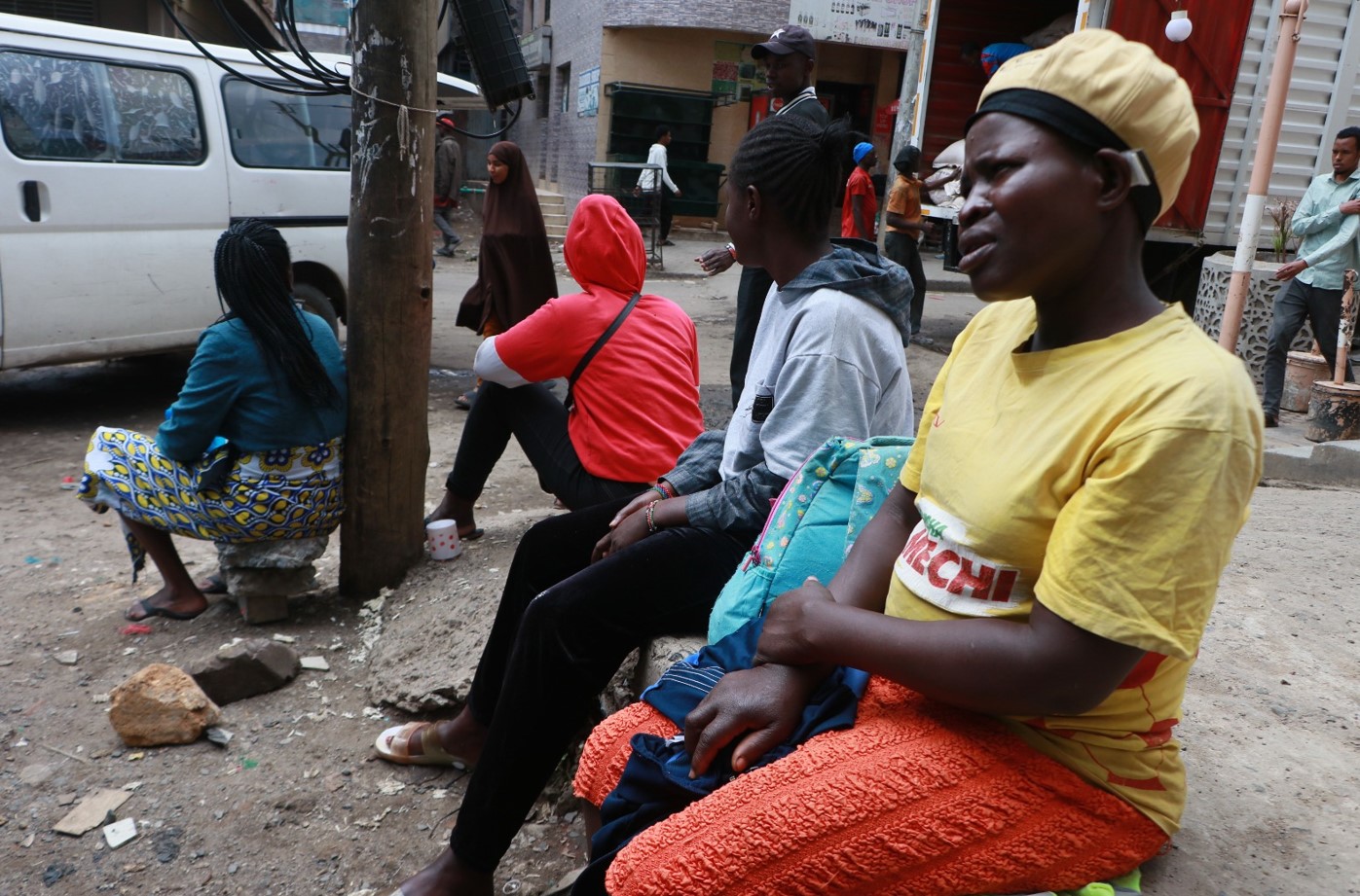 A group of women seated outside a building in Eastleigh on October 21, 2024, waiting for casual jobs. (Photo: Justine Ondieki)