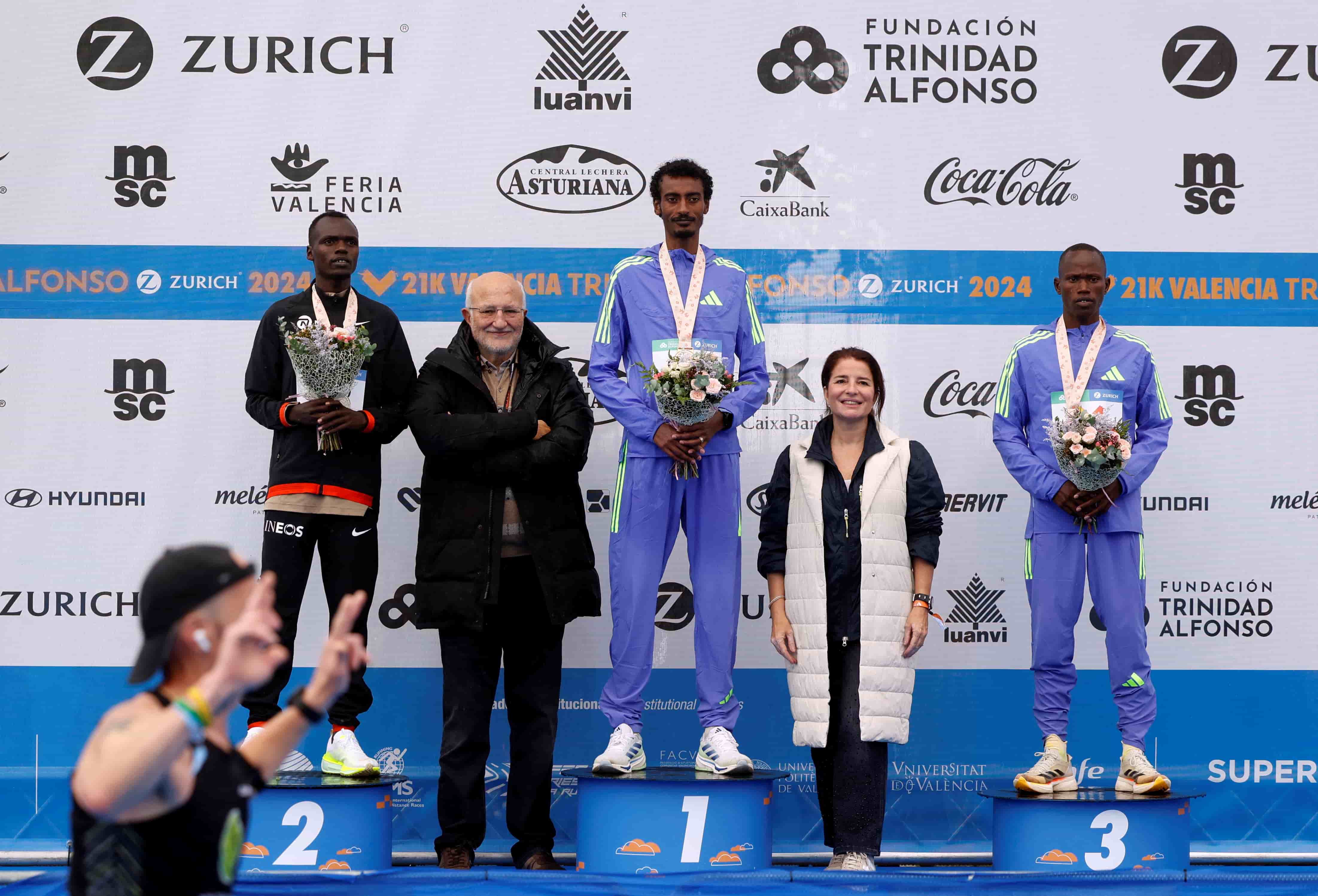 Ethiopia's Kejelcha breaks half marathon world record - Ethiopia's Yomif Kejelcha poses on the podium after winning and setting a new half marathon world record with a time of 57 minutes 30 seconds with businessman and president of the Trinidad Alfonso Foundation Juan Roig, Roig's daughter Hortensia, second placed Kenya's Daniel Mateiko and third placed Kenya's Isaia Kipkoech Lasoi REUTERS/Eva Manez