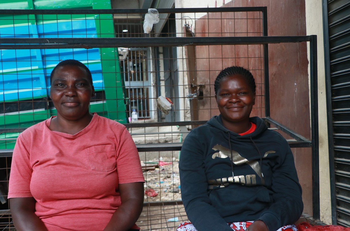 Rose Athiambo and Angela Mutiso, casual labour popularly known as ‘mama fua' wait for their employers to assign them jobs on October 21, 2024. (Photo by Justine Ondieki)