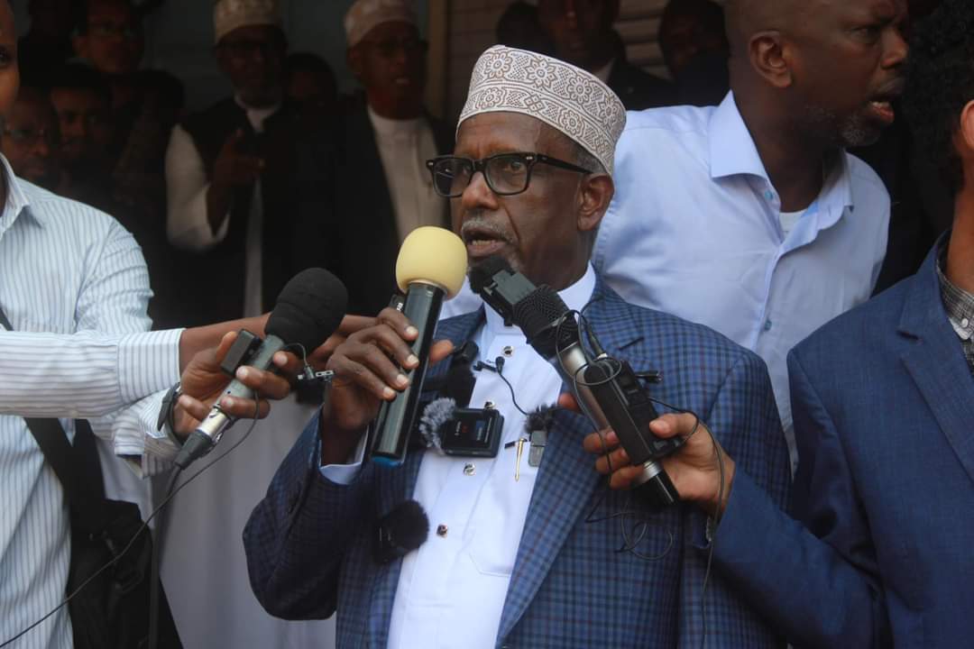 Ahmed Abdullahi, Chairman of the Eastleigh Business District Association addresses hundreds gathered in Eastleigh on Thursday, October 24, 2024, to honour Waris Daud, her daughter and niece who were murdered. (Photo: Abdirahman Khalif) 