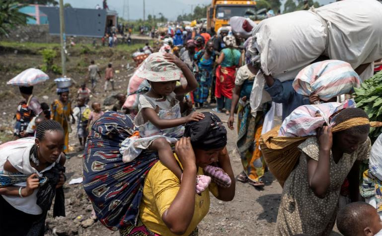 Rwandan foreign minister says Congo refused to sign deal to ease M23 conflict - Congolese people carry their belongings as they flee from their villages around Sake in Masisi territory, following clashes between M23 rebels and the Armed Forces of the Democratic Republic of the Congo (FARDC); towards Goma, North Kivu province of the Democratic Republic of Congo February 7, 2024. (Photo: REUTERS/Arlette Bashizi)