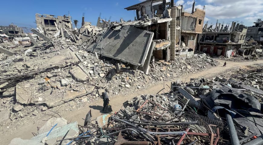 Gaza joblessness surges to 80 per cent as economy collapses – UN agency - Palestinians walk near rubble and destroyed buildings on October 10, 2024, amid the Israel-Hamas conflict, in Khan Younis, in the southern Gaza Strip. (Photo: File/REUTERS/Mohammed Salem)