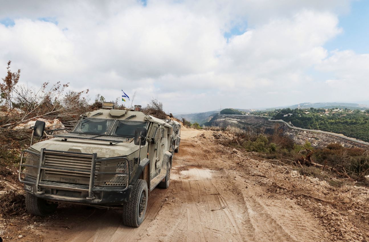 Israeli military vehicles are seen in southern Lebanon, as part of an incursion during hostilities between Hezbollah and Israel, October 13, 2024. (Photo: REUTERS/Artorn Pookasook)