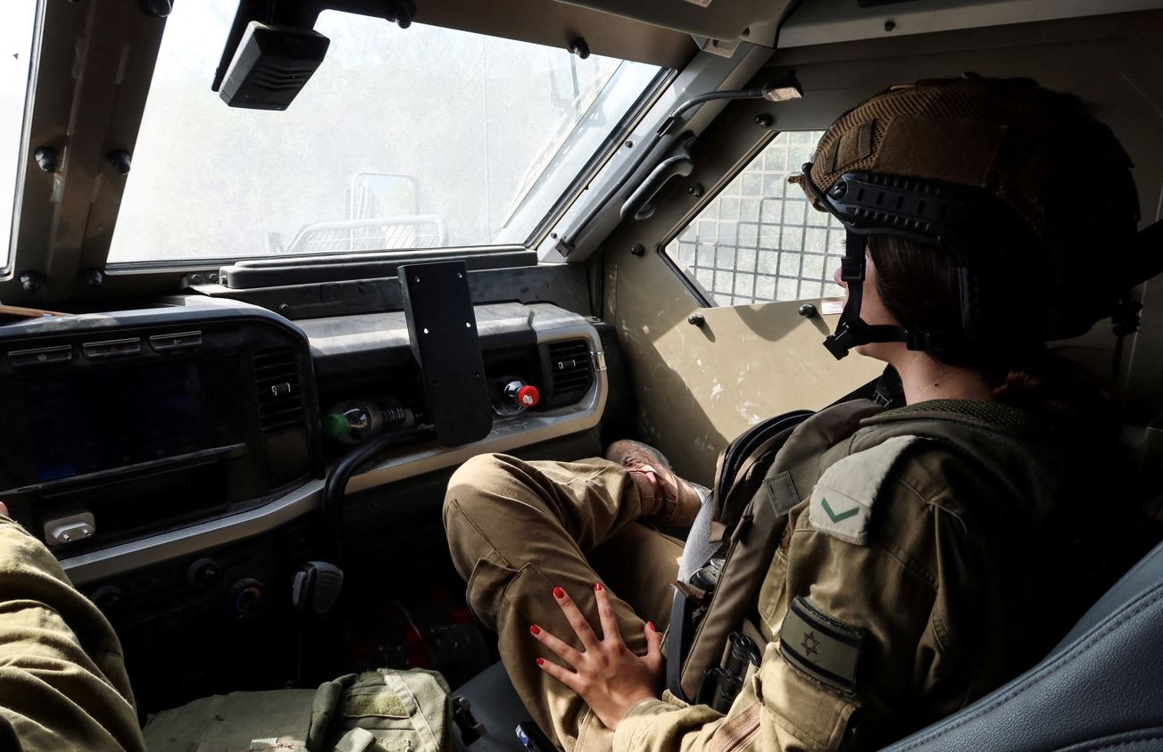 Israeli soldiers drive through southern Lebanon, as part of an incursion during hostilities between Hezbollah and Israel, October 13, 2024. (Photo: REUTERS/Artorn Pookasook)