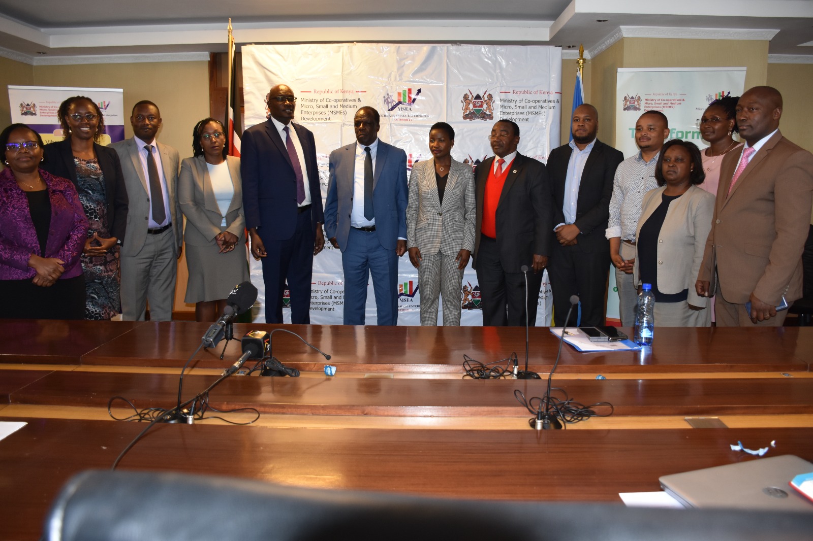 Cooperatives CS Wycliffe Oparanya, poses for a photo with officials of the National Organising Committee for the 24th EAC MSME Trade Fair set to be held in Juba. (Photo: Cooperatives Ministry)