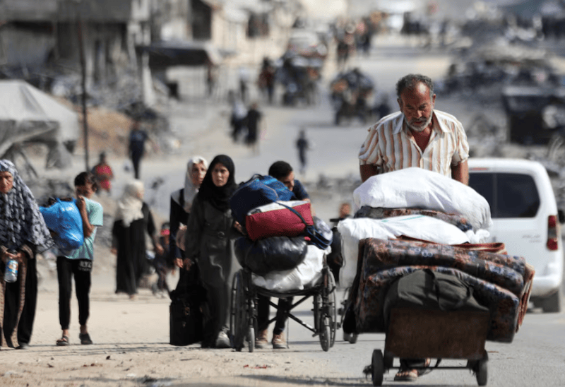 Israeli strikes kill 19 people in Gaza, tanks push north - Displaced Palestinians make their way as they flee areas in the northern Gaza Strip, following an Israeli evacuation order, amid the Israel-Hamas conflict, in Gaza City October 12, 2024. (Reuters)