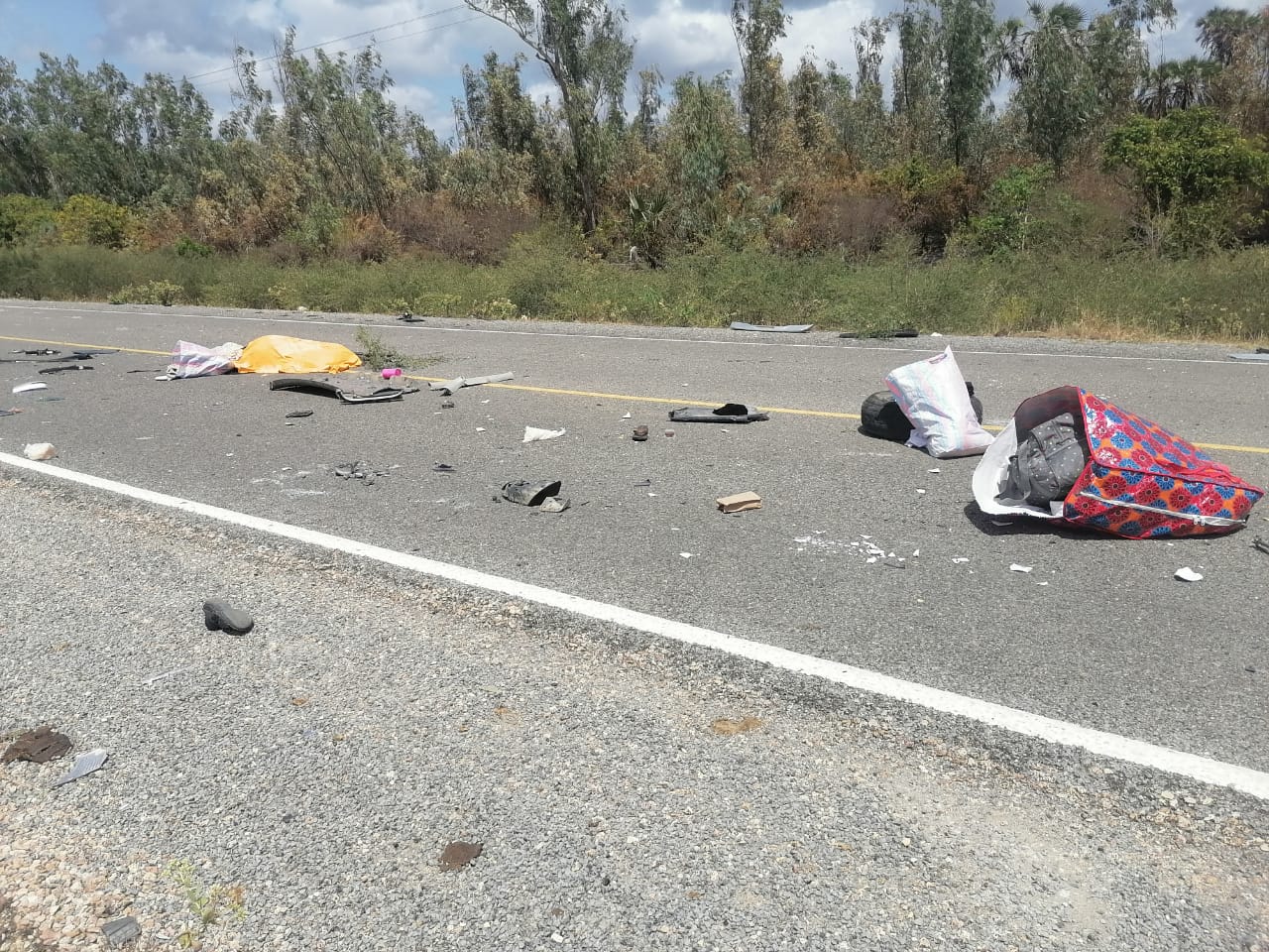 Goods scattered across the road after a Toyota Noah rolled at Mambo Sasa Forest along the Lamu-Witu-Garsen route on Monday, October 7, 2024. (Photo: Farhiya Hussein)