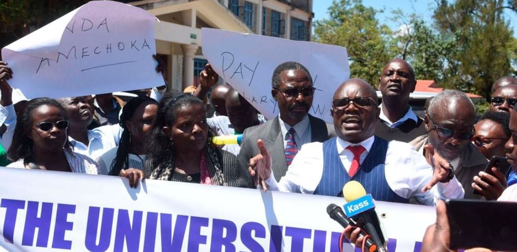 Lobby group calls for semester extension as lecturers' strike enters fourth week - UASU National Secretary General Dr Constantine Wesonga second (right), joins lecturers during their strike in Eldoret, Uasin Gishu County on August 29, 2024. Universities struggling remit pension with Sh25.9bn remaining unpaid. (Photo: Handout)