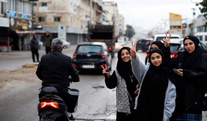 Israel-Hezbollah ceasefire holds in first hours, Lebanese civilians return to south - Women gesture as they welcome people coming back to Tyre after a ceasefire between Israel and Iran-backed group Hezbollah took effect at 0200 GMT on Wednesday, November 27, 2024. (Photo: REUTERS/Adnan Abidi)